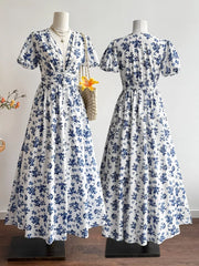 Delightful floral v-neck maxi dress with short sleeves and a cinched waist.