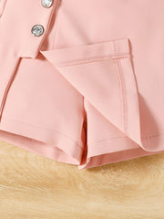 Pink toddler shorts with decorative buttons and a-line cut