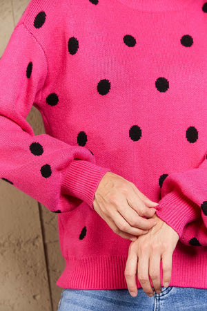 Hot Pink polka dot knit sweater with balloon sleeves and ribbed cuffs.