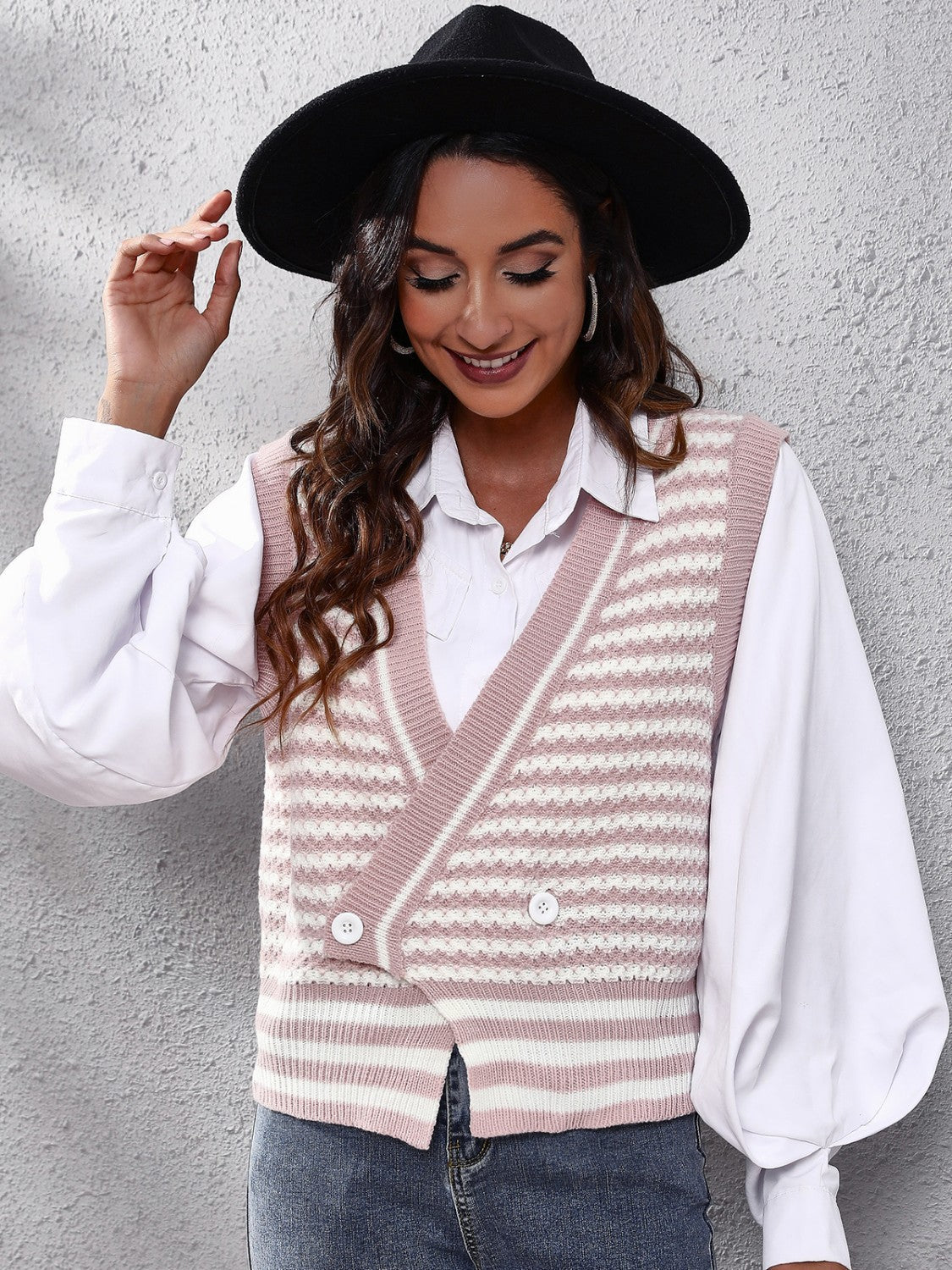 Double-breasted dusty pink and white stripe knit vest with button detail.
