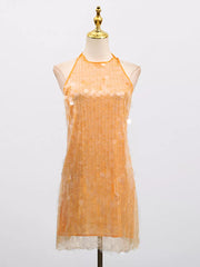 Orange iridescent sequin halter mini dress with a sheer hem.