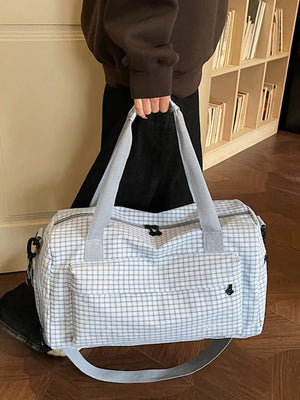 Elegant plaid travel bag with versatile straps and front pockets