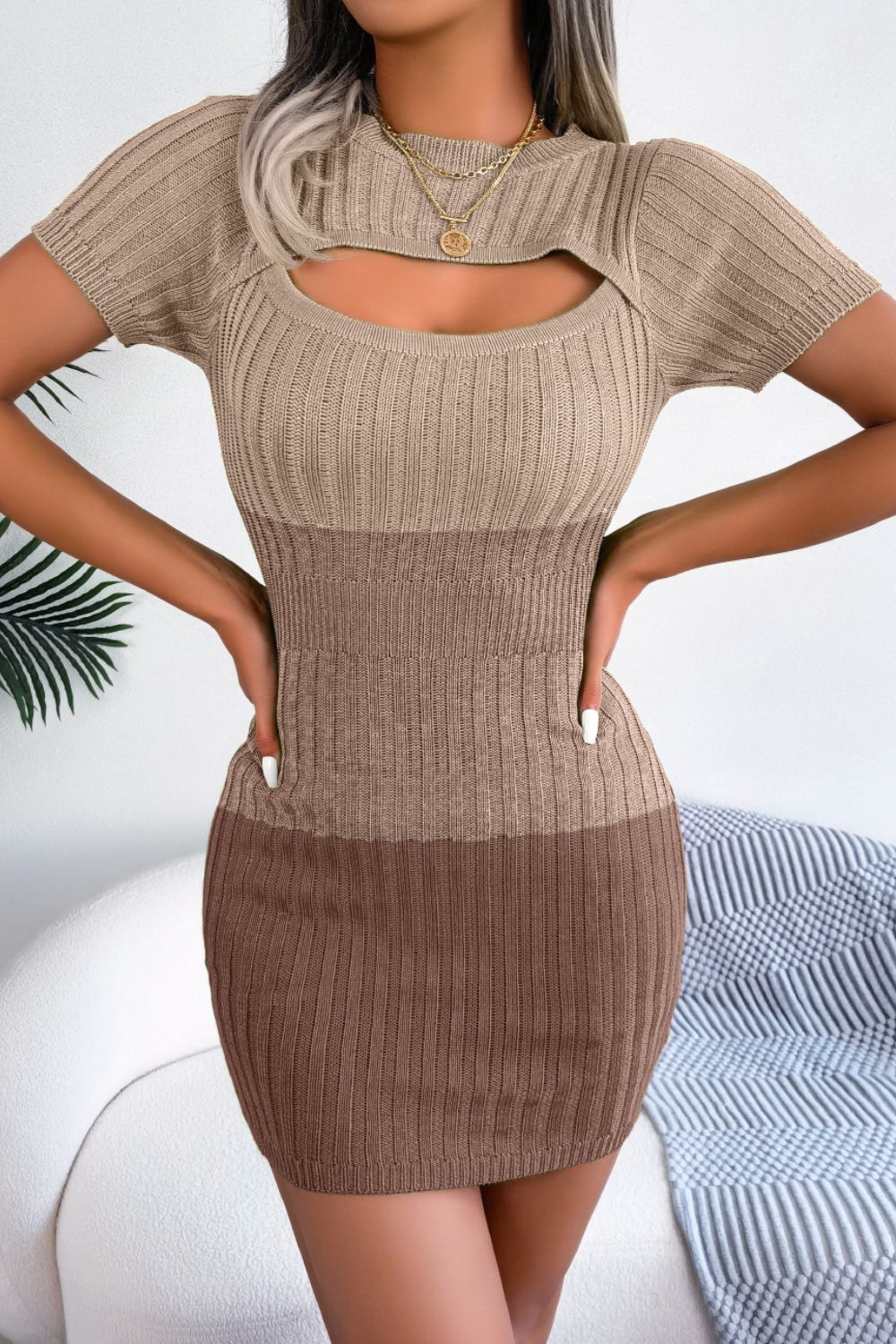 Ribbed knit mini dress in khaki and brown with cutout neckline and short sleeves.