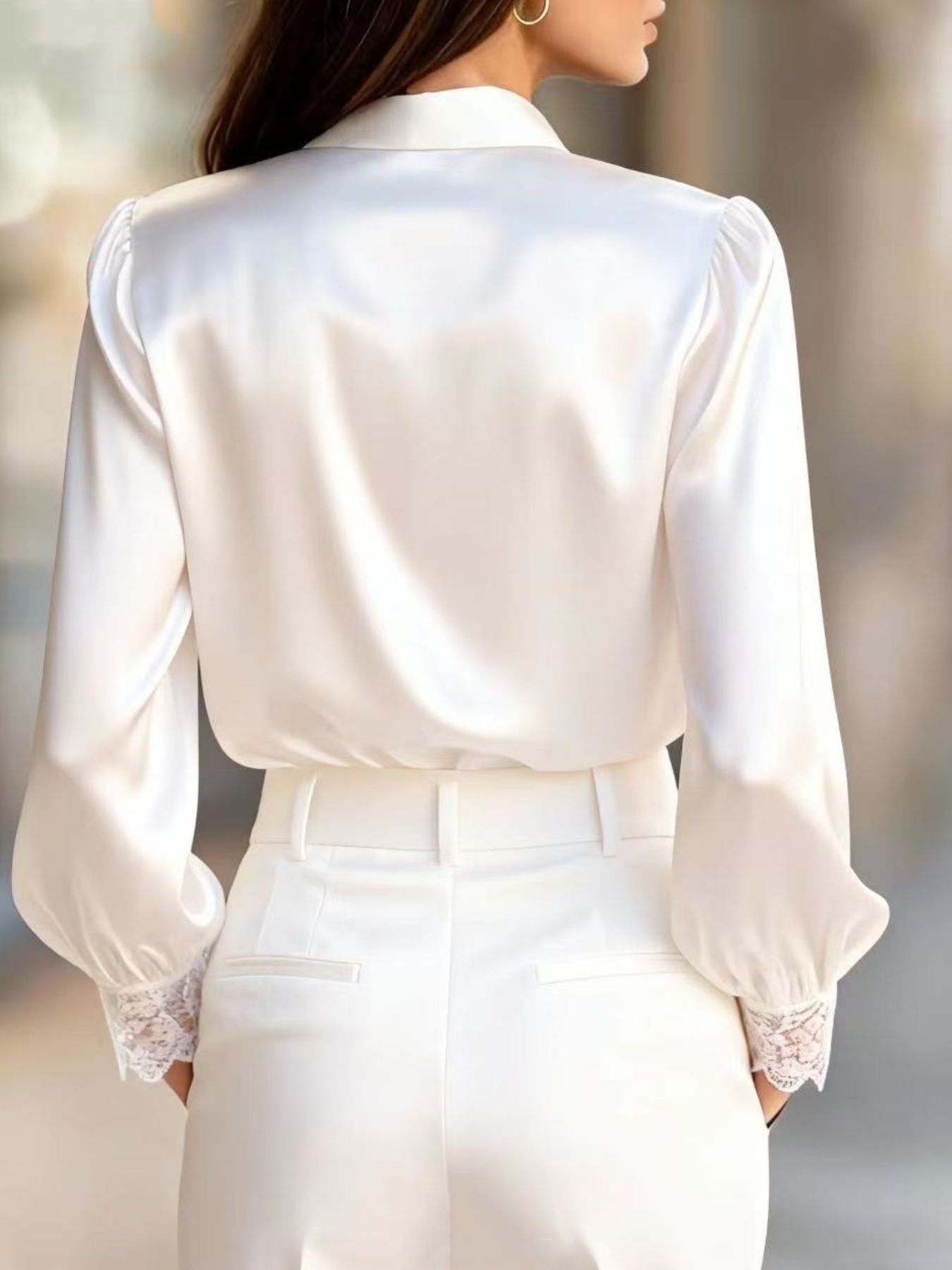 White satin button-up shirt with balloon sleeves and lace trim cuffs