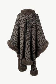 Leopard print cape with faux fur trim in beige, featuring a cozy collar and hem detail.