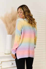 Rainbow gradient slouchy V-neck knit sweater in acrylic with pastel colors.