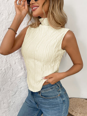 Textured sleeveless mock neck top in cream with a crinkled pattern.