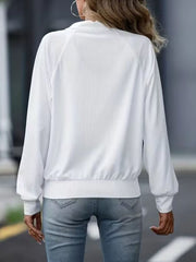White ribbed raglan zip-up jacket with a high collar and elastic cuffs.