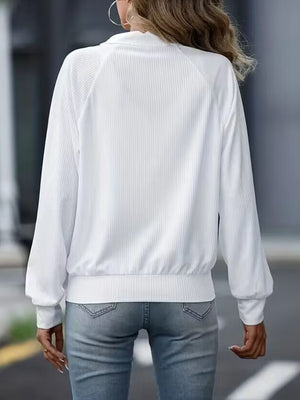 White ribbed raglan zip-up jacket with a high collar and elastic cuffs.