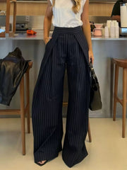Wide-leg pants in dark blue with white pinstripes, featuring a high waist and flowing silhouette.