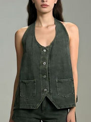 Button-down denim halter vest in dark gray with two front pockets and a V-neckline.