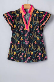 Vibrant floral print cotton blouse with contrast trim neckline and flutter sleeves.