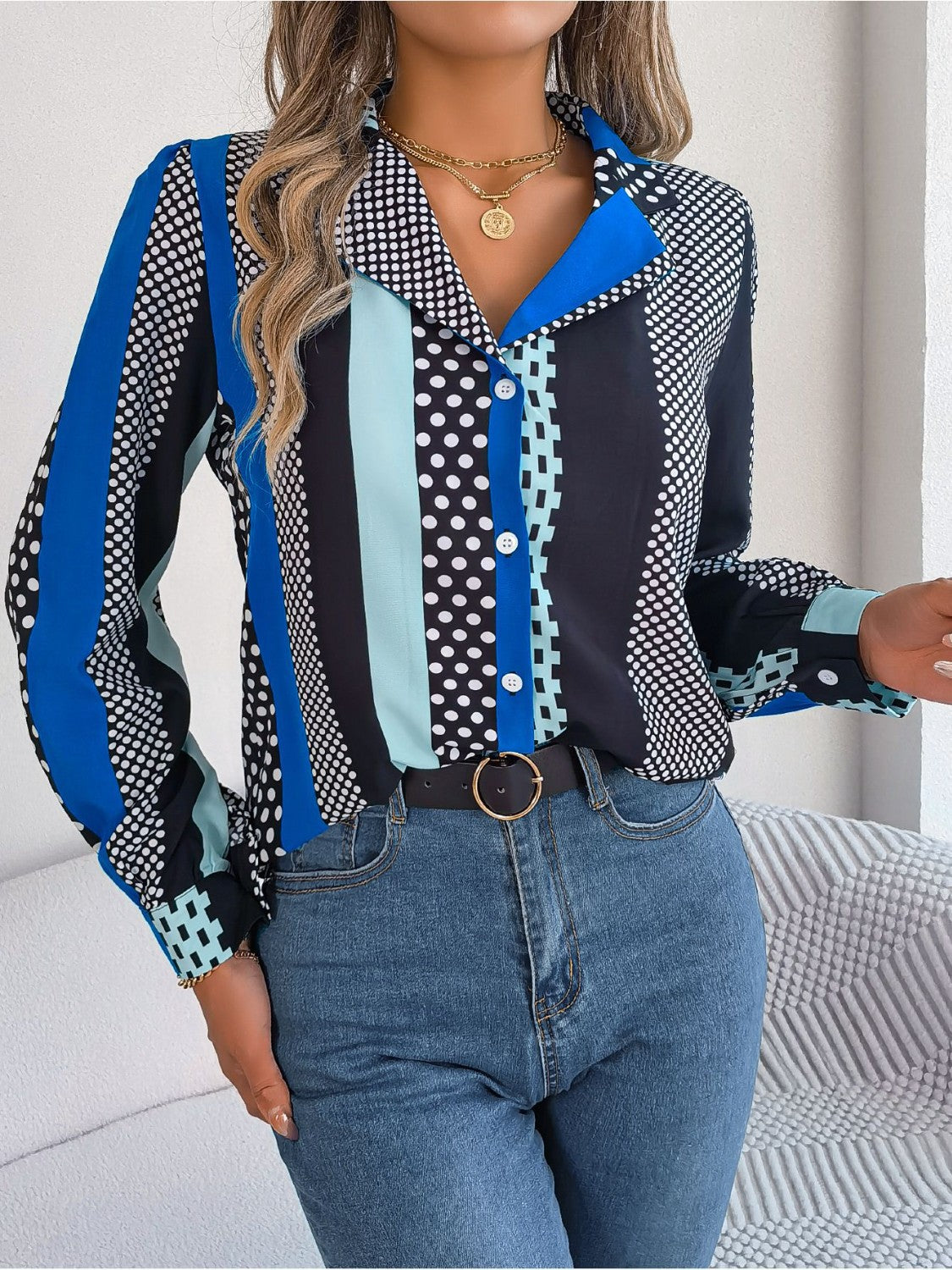 Collared blouse with black, blue, and mint green panel print and polka dots.