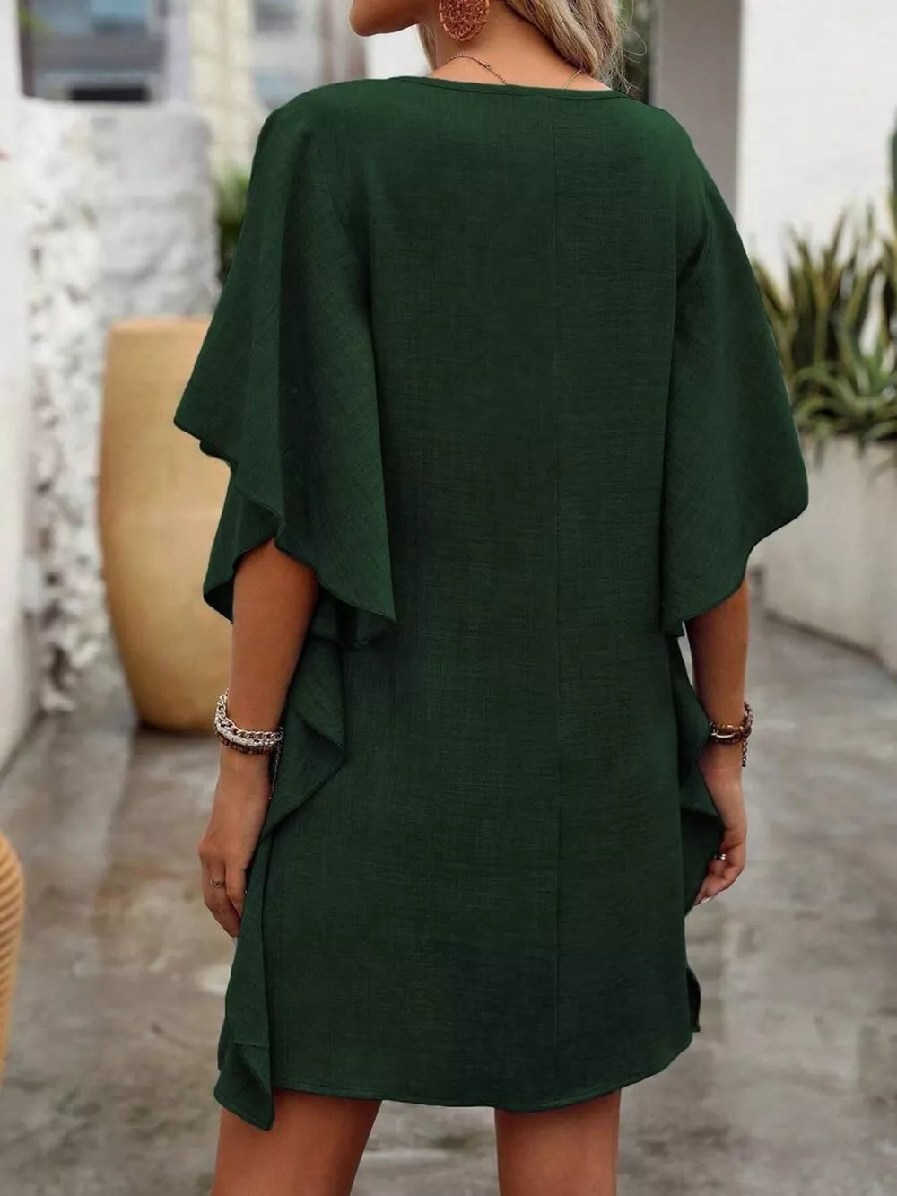 Army green mini dress with ruffled sleeves and V-neck, casual style.