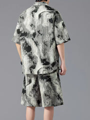 Men's casual set with tie-dye pattern, short sleeves, and shorts.