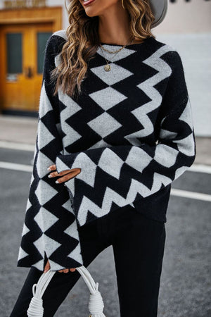 Black chevron knit sweater with bell sleeves and a crew neck.