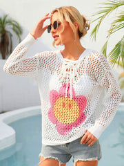 White lace-up knit hoodie with smiley flower graphic.