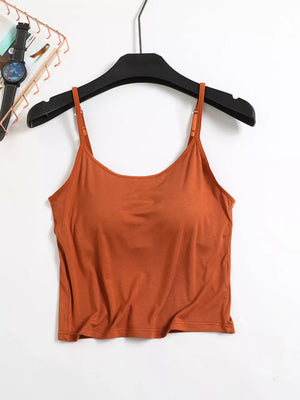 Caramel cami with adjustable spaghetti straps and a scoop neckline.