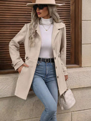 Camel button-up trench coat with cinched waist, buttoned cuffs, and lapel collar.