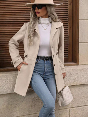 Camel button-up trench coat with cinched waist, buttoned cuffs, and lapel collar.