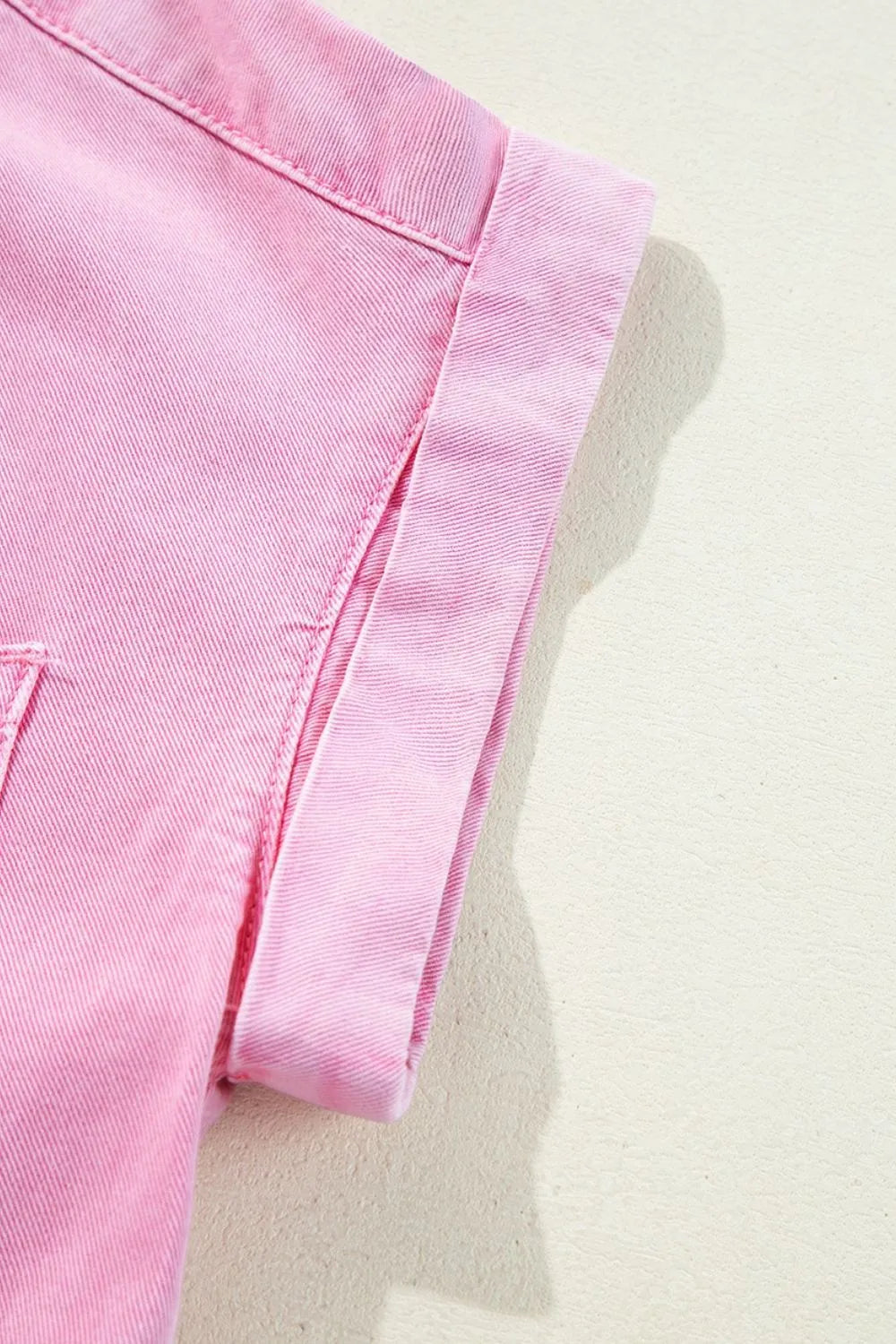 Rolled sleeve denim shirtdress in blush pink with button details.