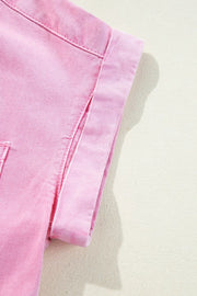 Rolled sleeve denim shirtdress in blush pink with button details.