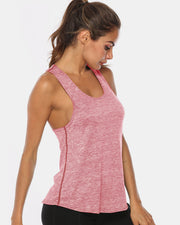 Racerback performance tank top in heathered blush pink with contrast stitching.
