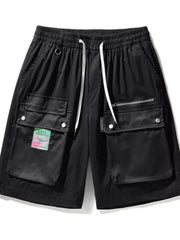Black cargo shorts with multiple pockets, drawstring waist, and a colorful tag.