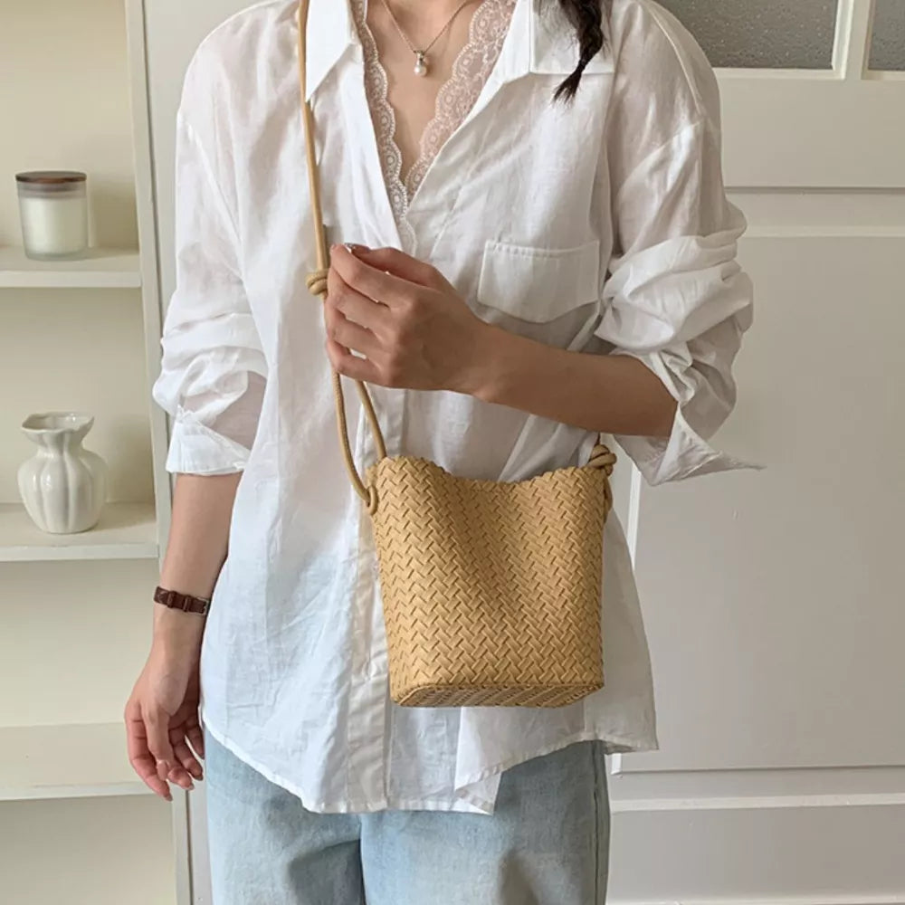 Woven Straw Crossbody Bag in Yellow, close-up detail