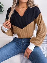 Chevron block knit polo sweater in camel, black, and white with a V-neck.