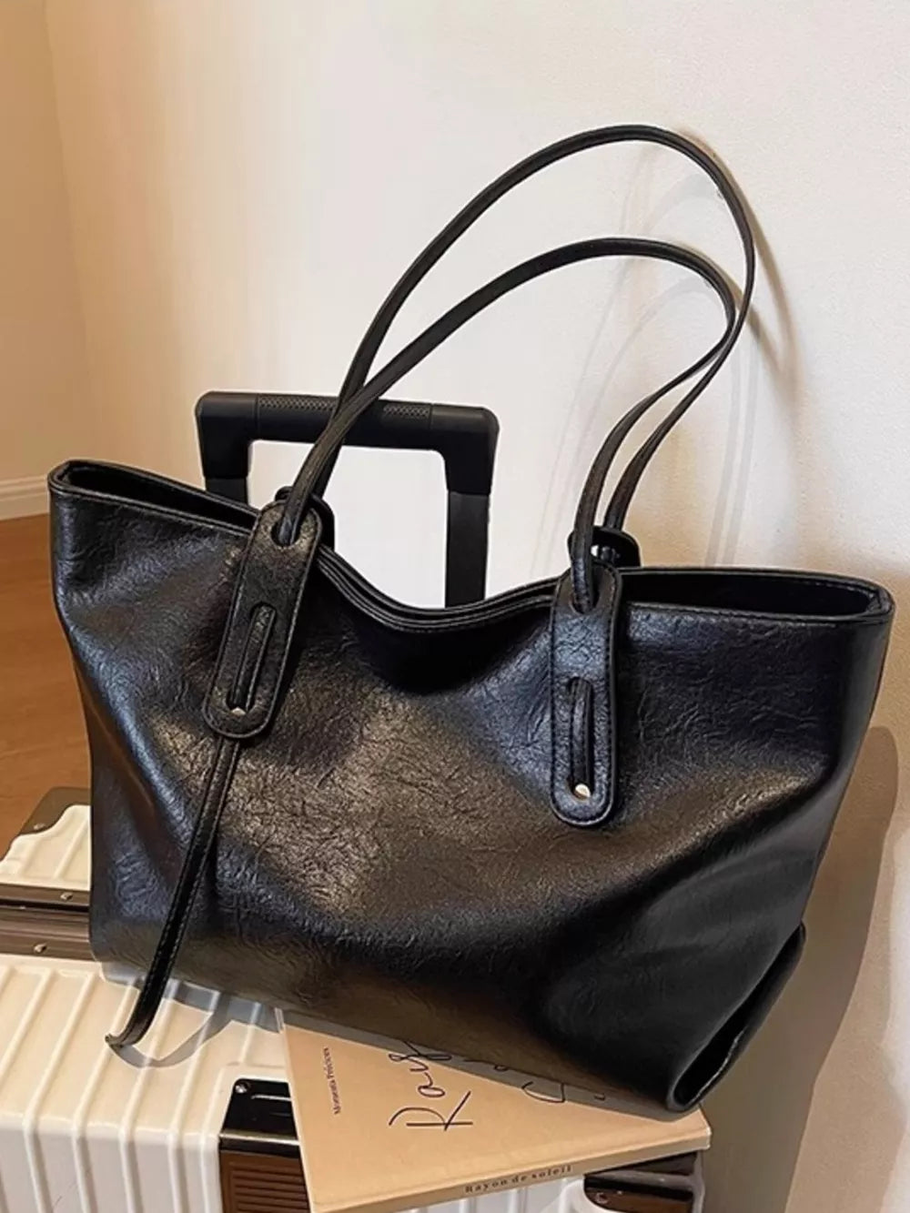 Black large pu leather shoulder bag with double straps and a relaxed slouch.
