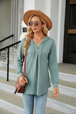 Textured hooded tunic in Sage with button detail and drawstring neckline.