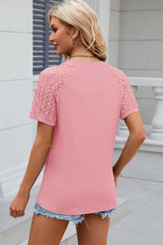 Blush pink ribbed tee with lace raglan sleeves and a crew neck.