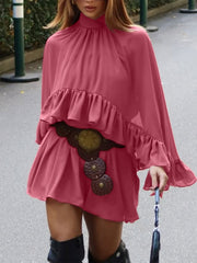 Deep rose mini dress with ruffle trim, high neck, and bell sleeves.