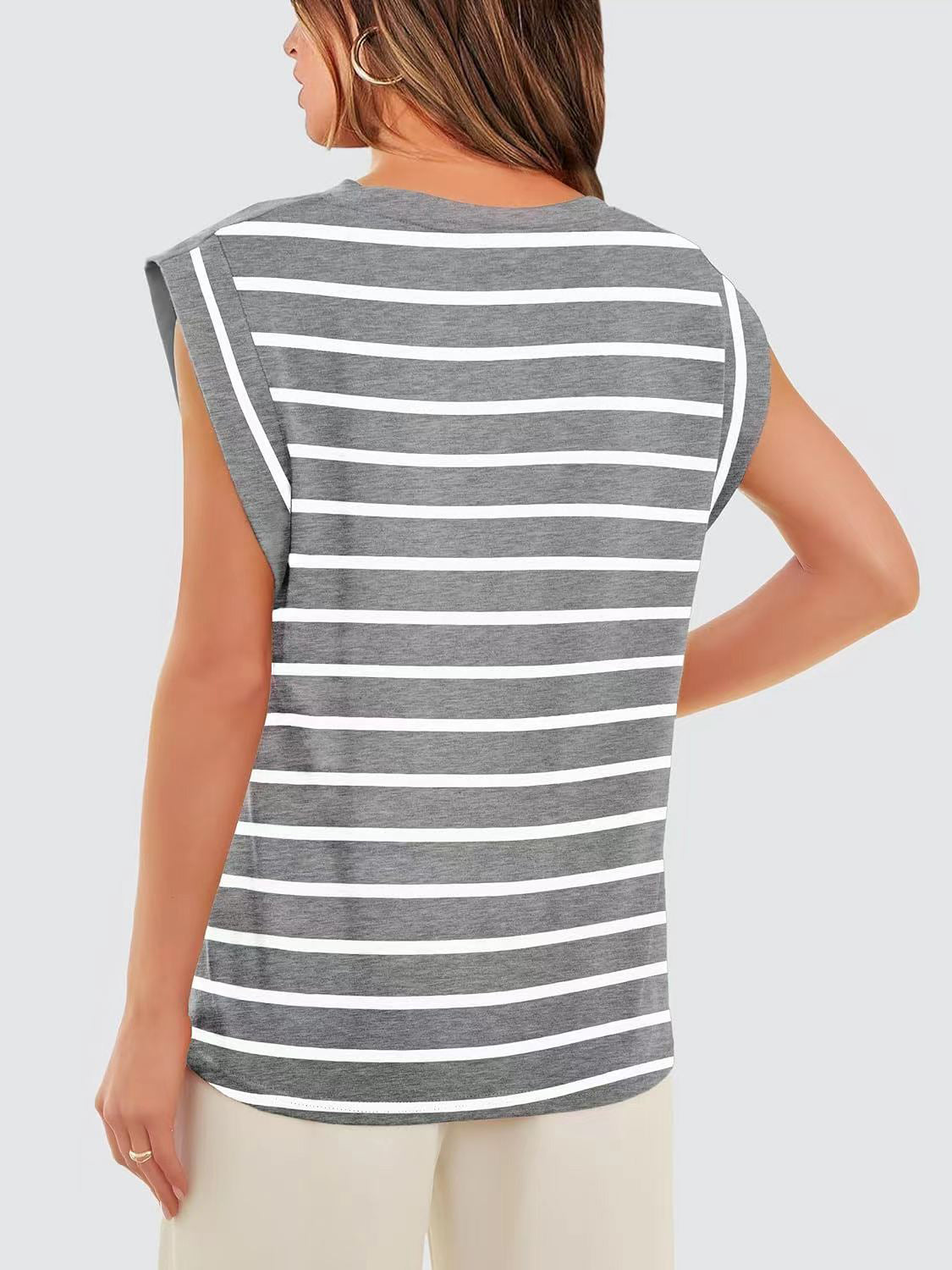 Tank top with padded shoulders and white horizontal stripes on grey fabric.