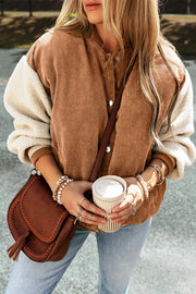 Corduroy bomber jacket with sherpa sleeves in Terracotta, featuring contrast sleeves and snap closure.