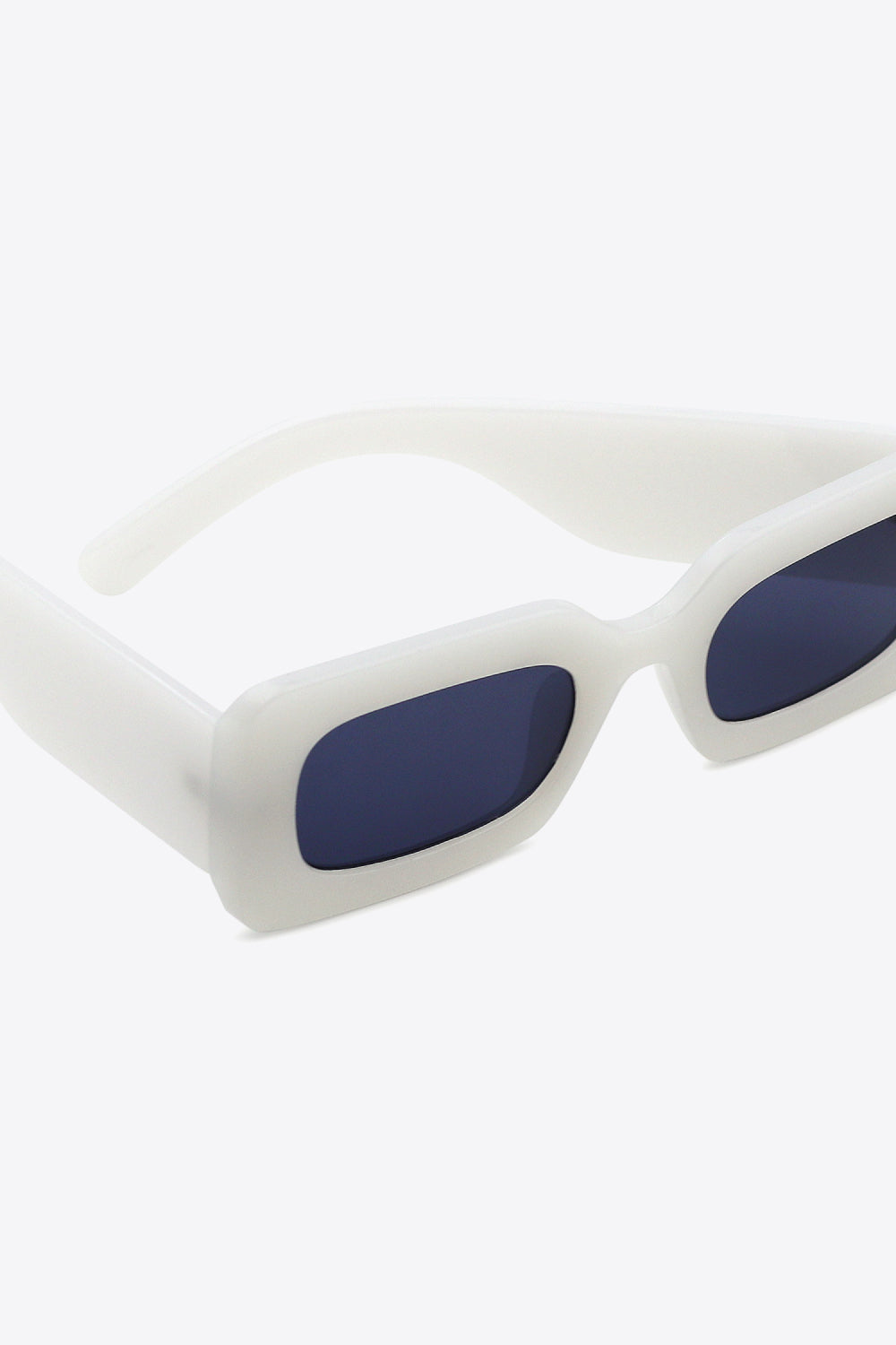 White acetate rectangle sunglasses with dark lenses.
