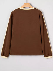 Contrast crew-neck long-sleeve t-shirt in dark brown with cream trim on sleeves and neckline.