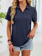 Indigo eyelet polo collar blouse with short sleeves and a chest pocket.