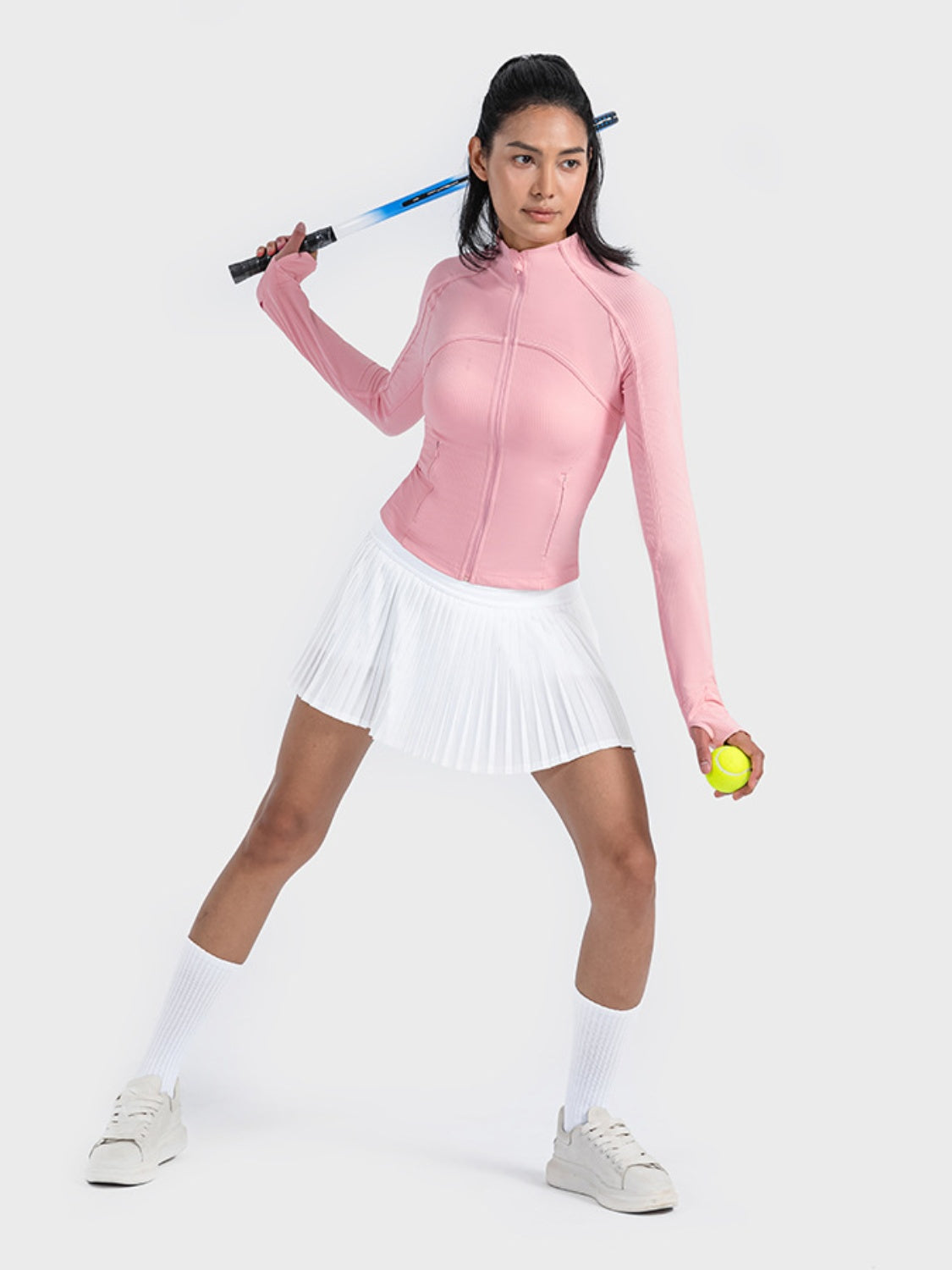 Carnation pink ribbed performance zip-up track jacket with thumbholes.