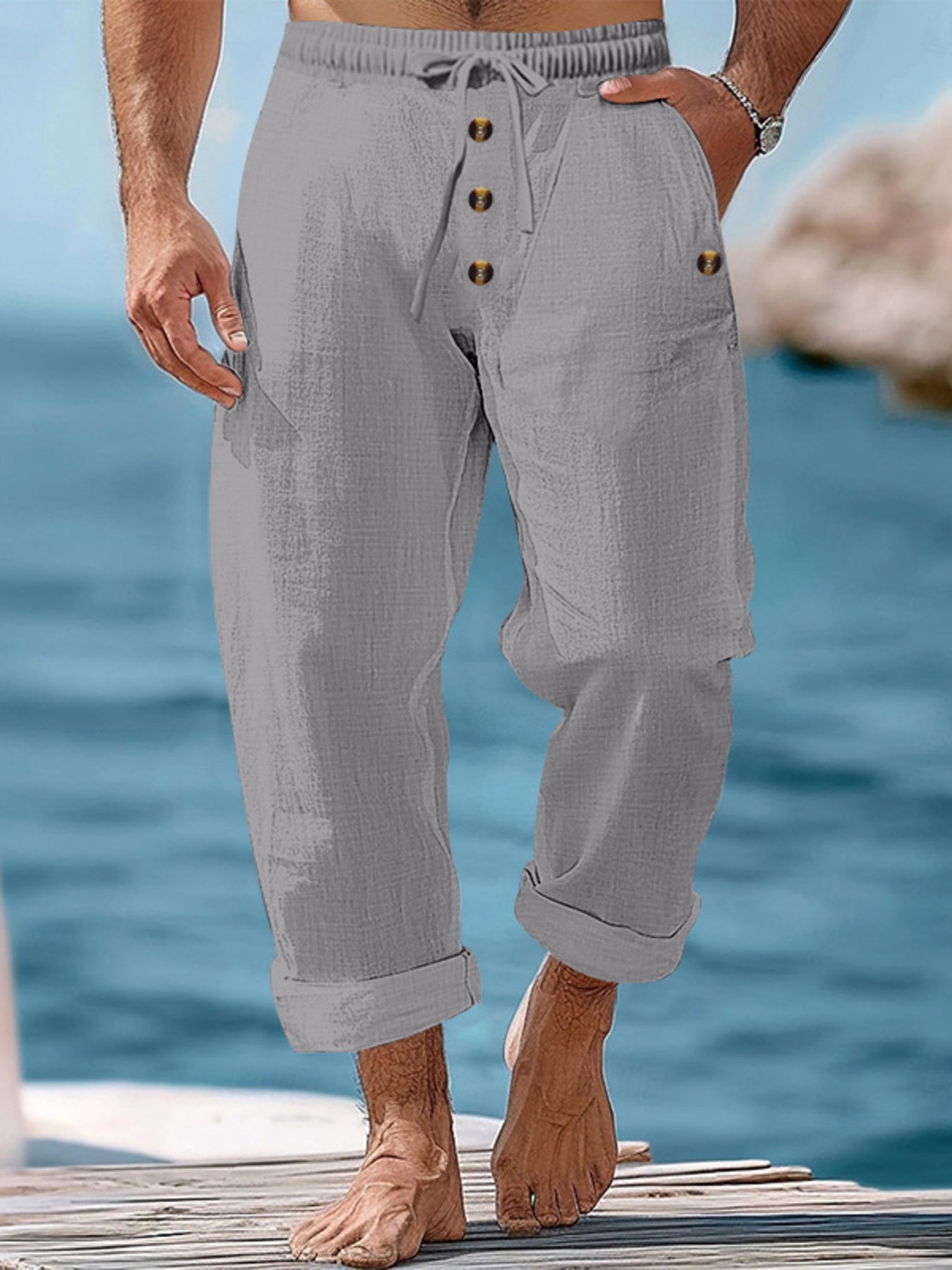 Gray relaxed fit drawstring sweatpants with button fly and cuffed hem