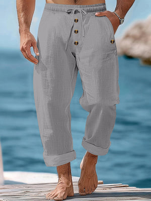 Gray relaxed fit drawstring sweatpants with button fly and cuffed hem