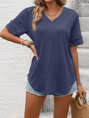 Navy blue V-neck t-shirt with lace trim on the sleeves.
