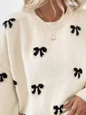 black pullover sweater featuring ribbed and bow-print