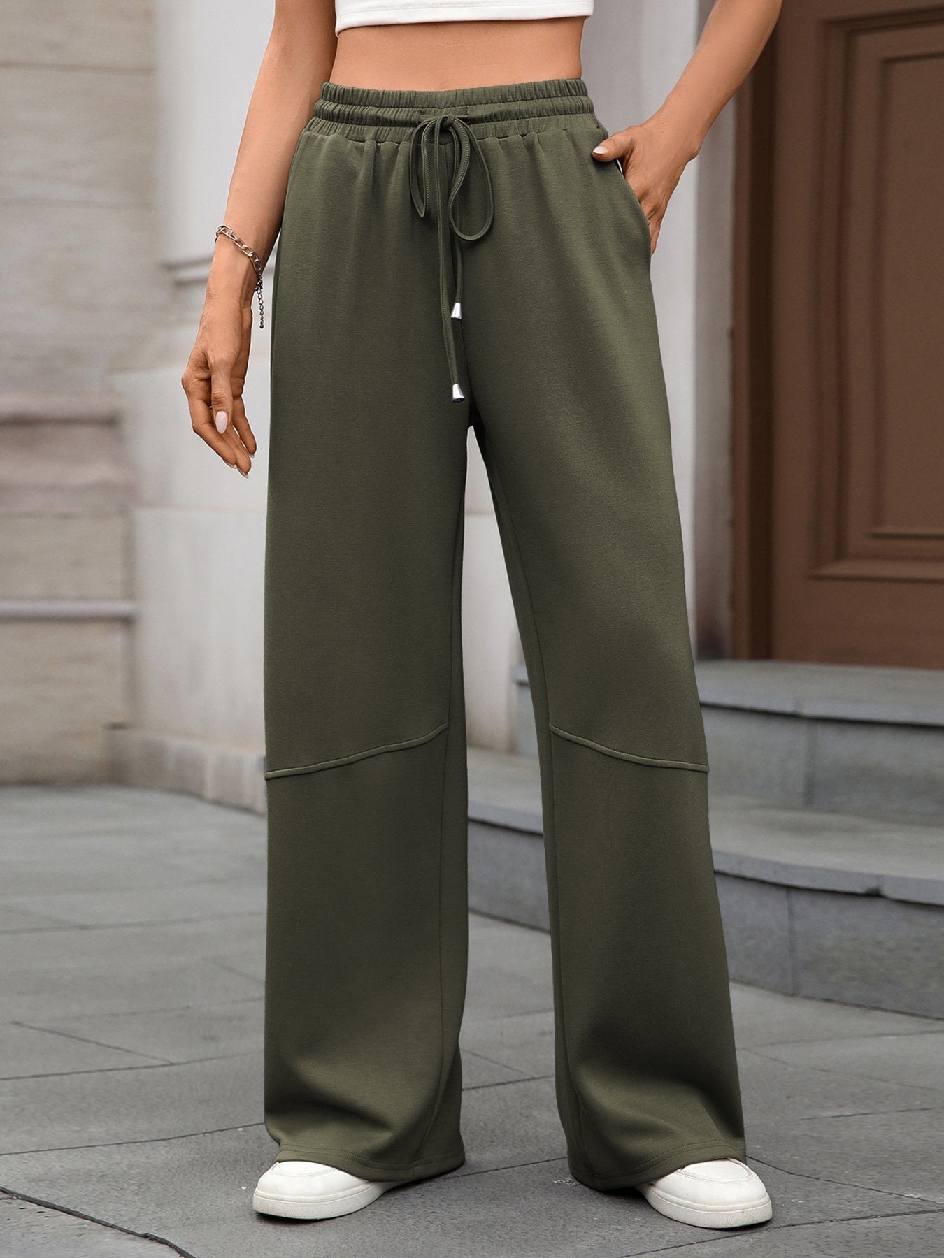 Army green high-waist drawstring wide-leg pants with pockets and seam detail