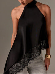 Elegant beige halter camisole with lace trim.