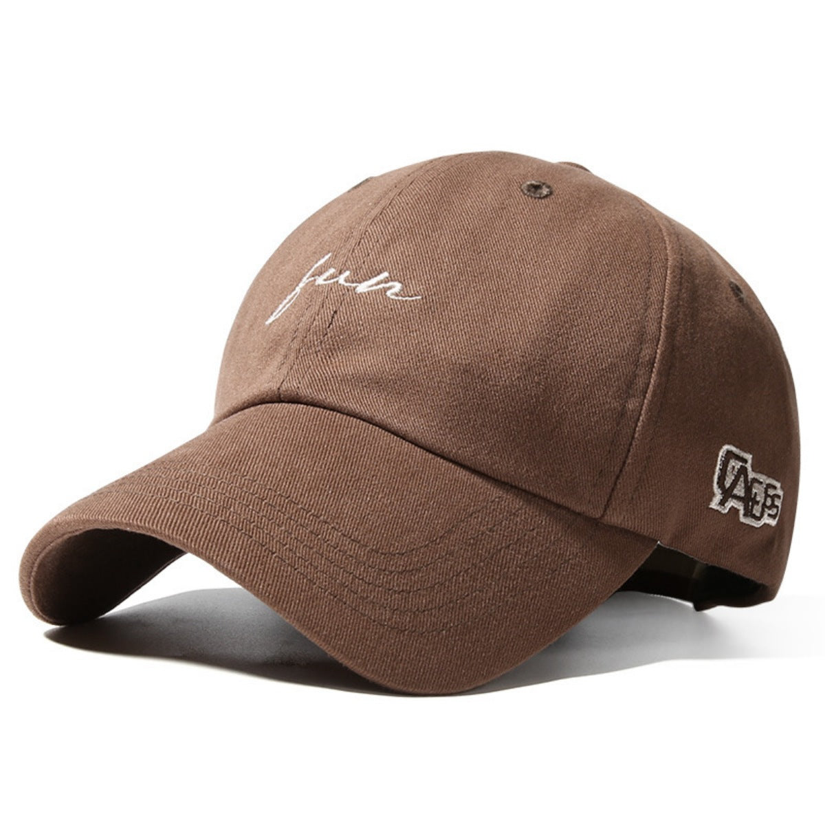 Brown cotton baseball cap with white embroidered script and logo detail.