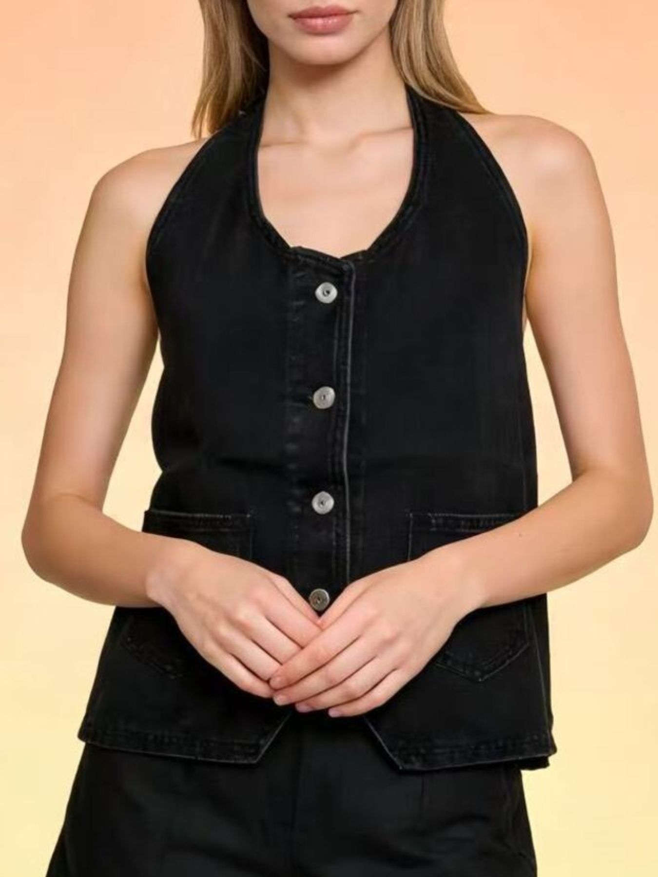 Black denim halter vest with button-down front and pocket details