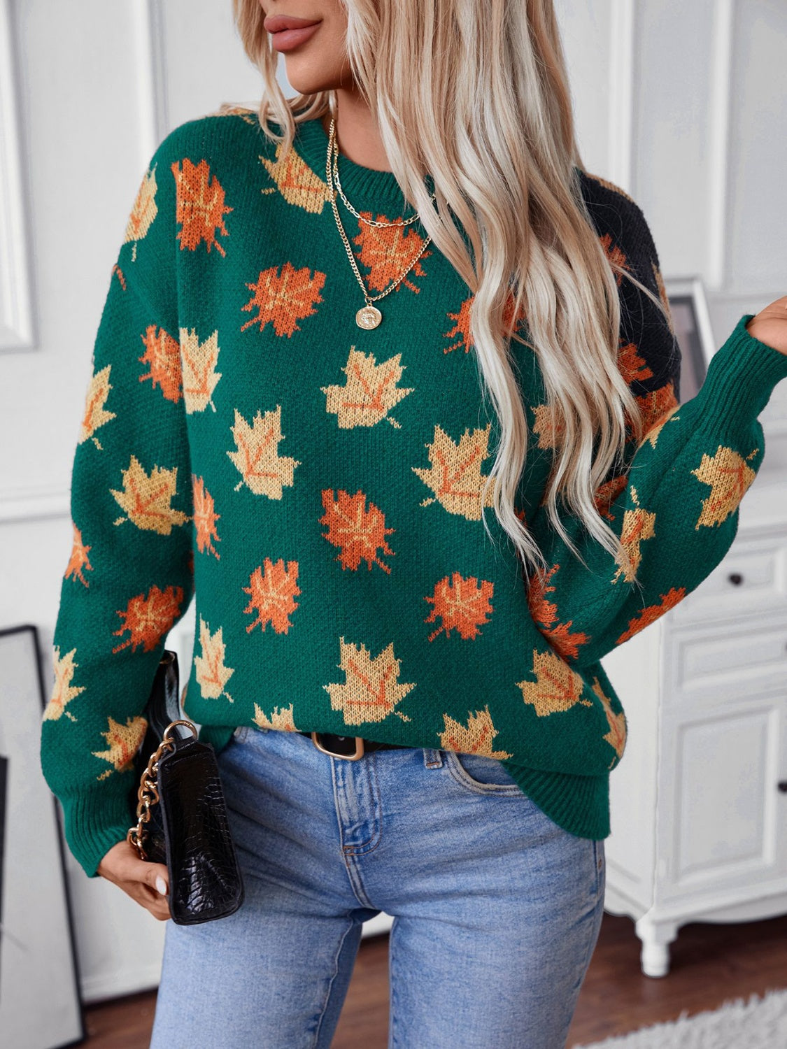 Green knit jumper with autumnal leaf motif, crew neck, long sleeves.