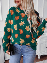 Green knit jumper with autumnal leaf motif, crew neck, long sleeves.
